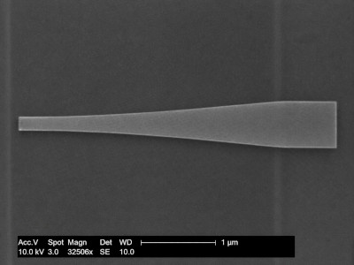 SEM-style image of a tapered waveguide showing a narrow input section expanding into a wider output section
