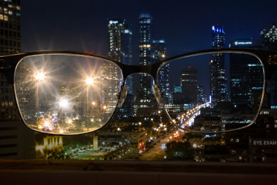 Photograph showing reduced glare from anti-reflective coated glasses